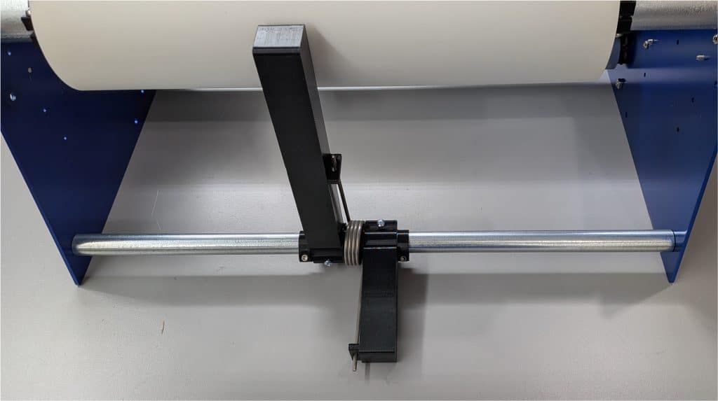 Brake that applies friction to the roll