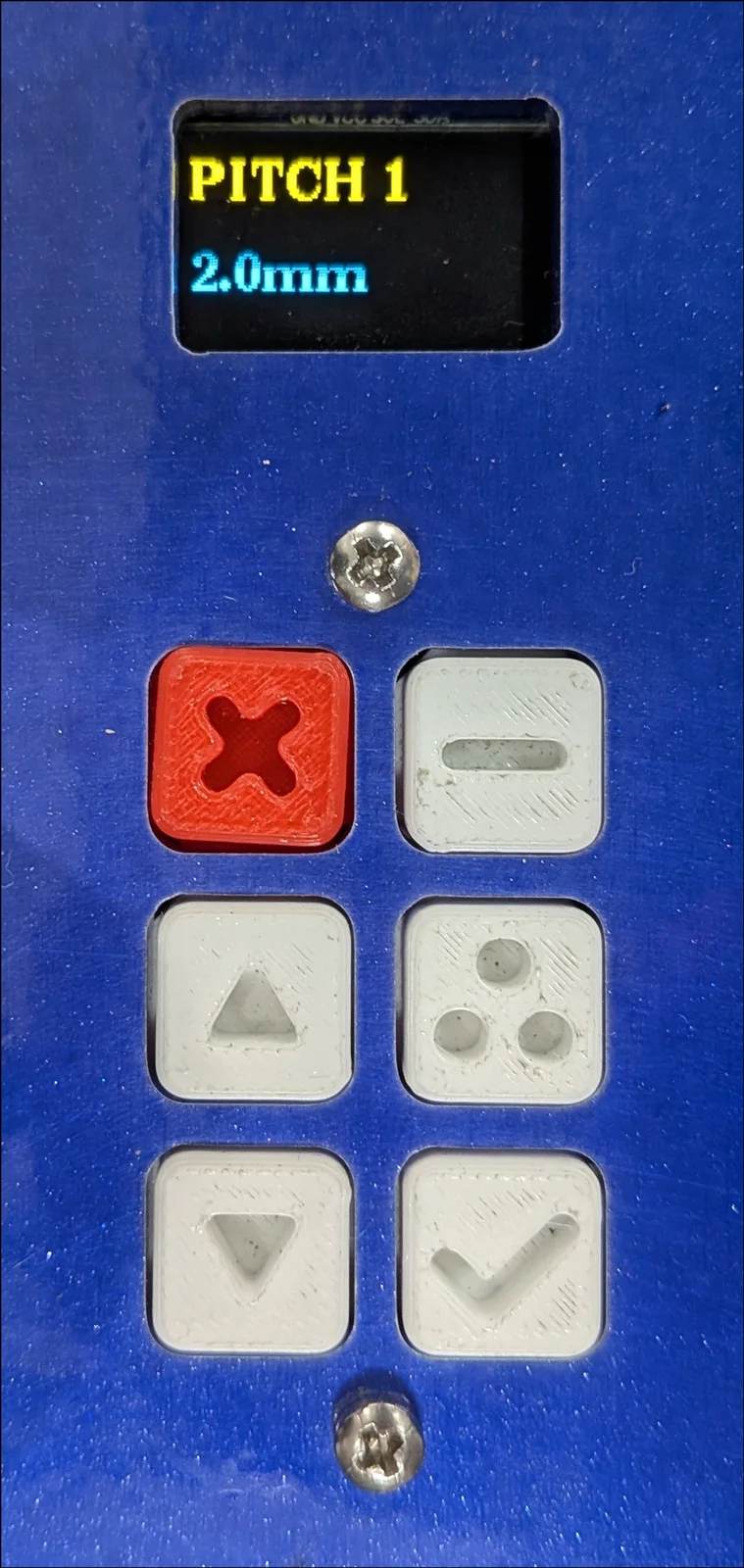 Spring forming machine OLED control panel showing Pitch 1 set to 2.0 millimeters